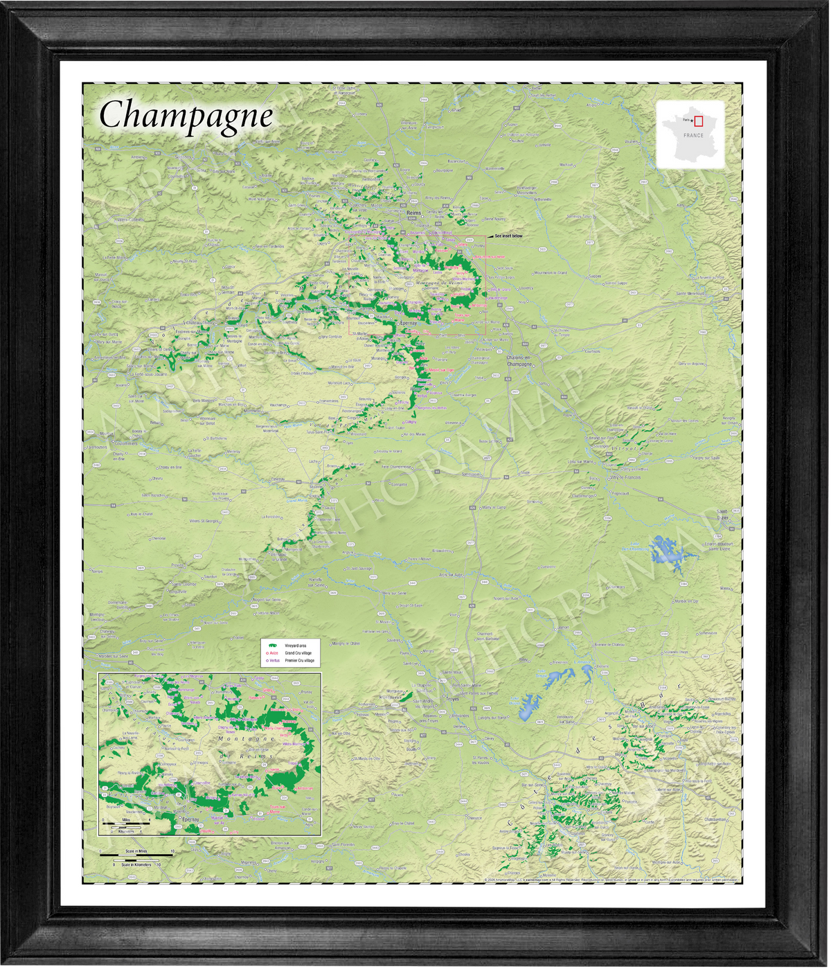 A framed topographical map of Champagne, featuring a light green and beige terrain design with green river valleys, enclosed in a black frame with a white mat border.